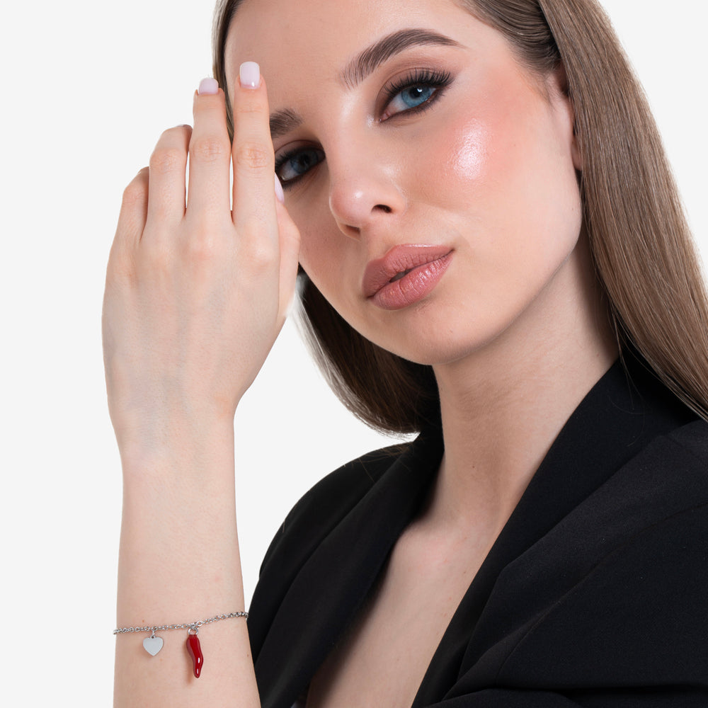 DAMENARMBAND AUS STAHL MIT HERZ UND ROTEM HORN