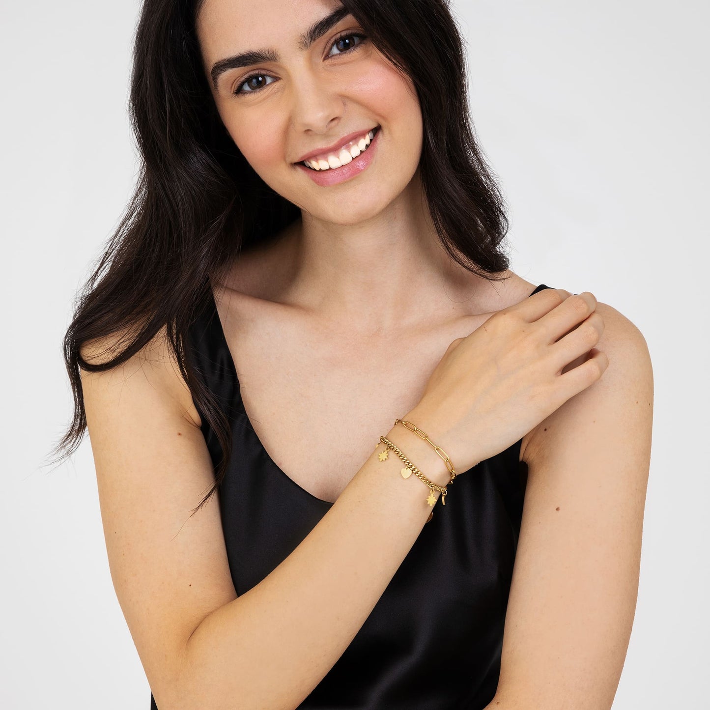 DAMENARMBAND AUS VERGOLDETEM STAHL MIT HERZEN UND STERNEN