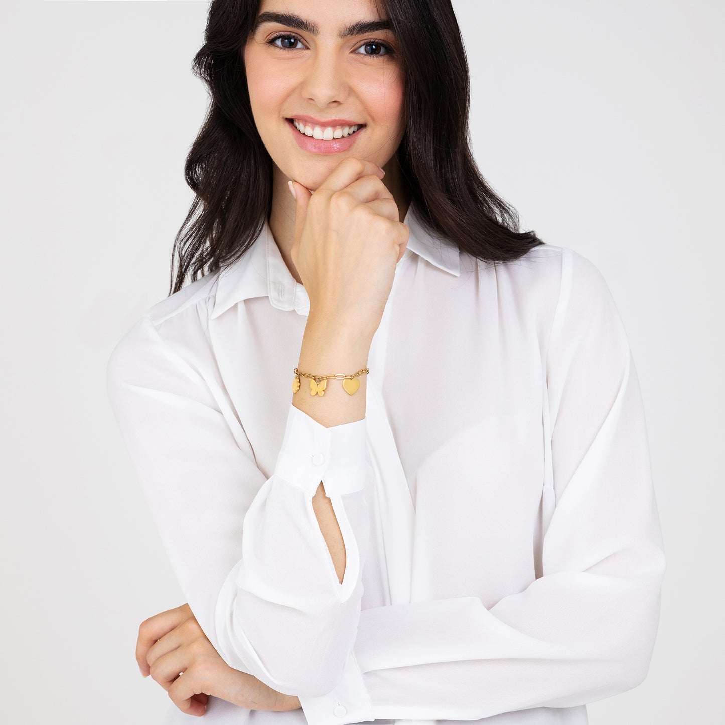 DAMENARMBAND AUS VERGOLDETEM STAHL MIT HERZ, SCHMETTERLING UND VIERBLÄTTRIGEM KLEEBLATT