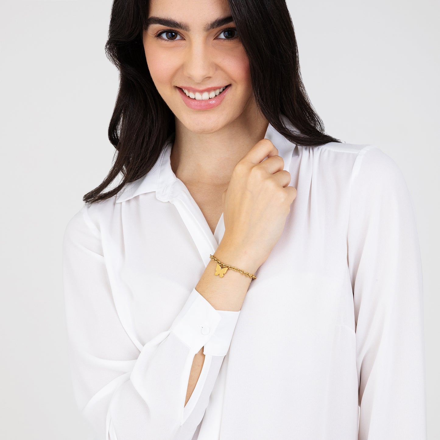 DAMENARMBAND AUS VERGOLDETEM STAHL MIT SCHMETTERLING