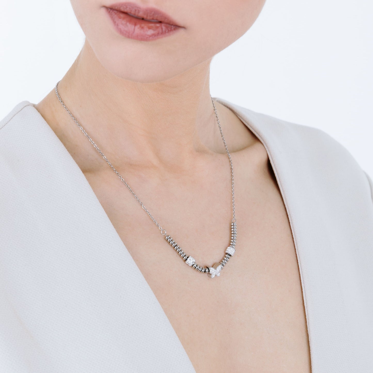 SCHMETTERLINGSHALSKETTE AUS STAHL MIT WEISSEN KRISTALLEN