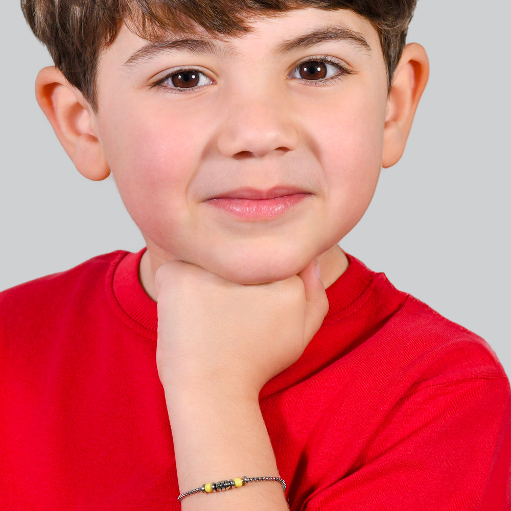 STAHL-BABYARMBAND GELBE STEINE