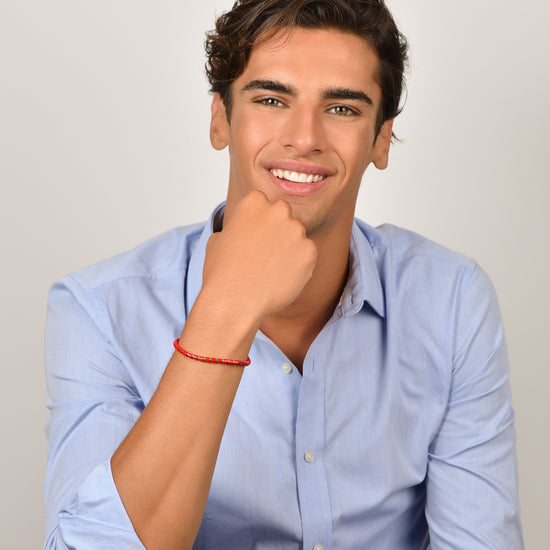 HERRENARMBAND AUS STAHL MIT ROTEN STEINEN