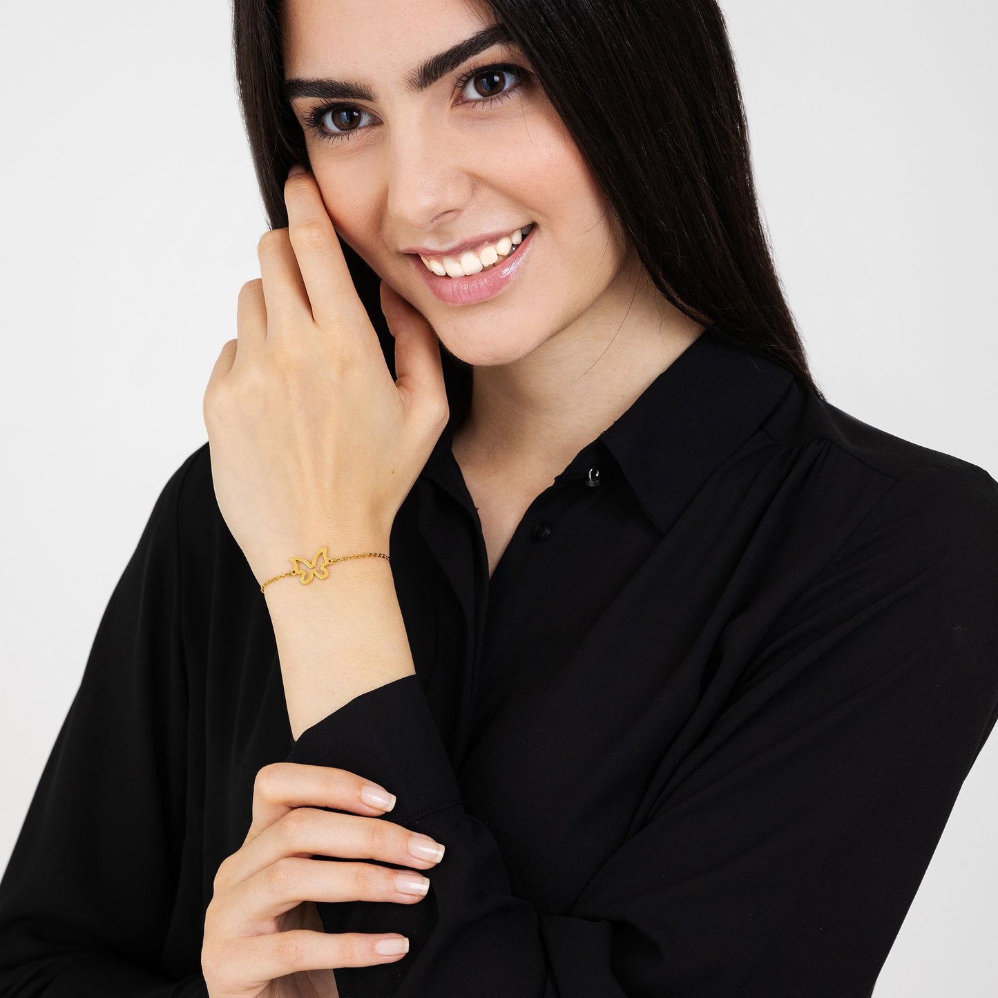 DAMENARMBAND AUS VERGOLDETEM STAHL MIT HOHLEM SCHMETTERLING