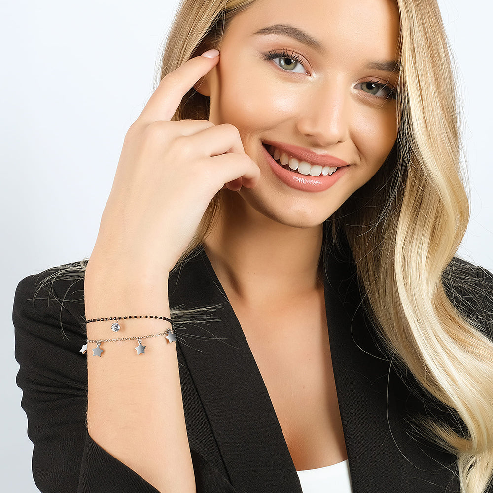 DAMENARMBAND AUS STAHL MIT STERNEN, SCHWARZEN IP-ELEMENTEN UND WEISSEM KRISTALL