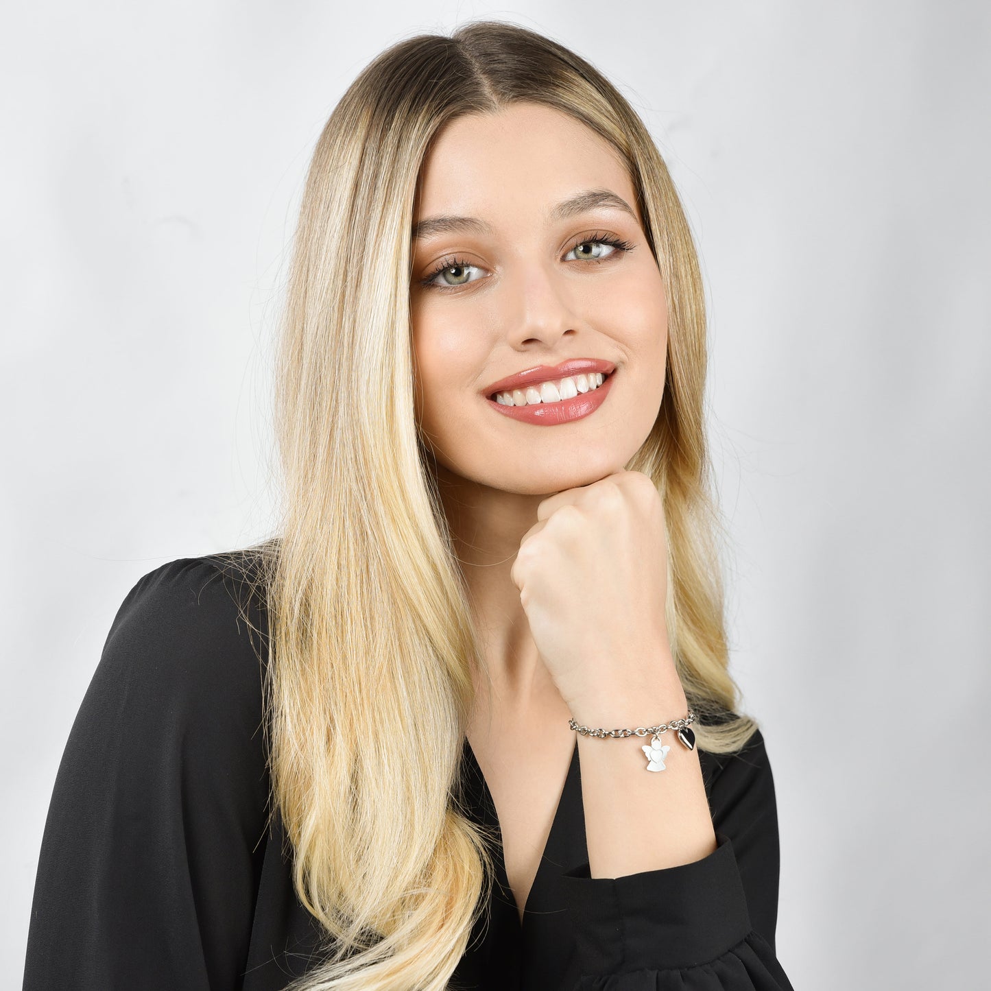 DAMENARMBAND AUS STAHL MIT ENGEL UND HERZANHÄNGER