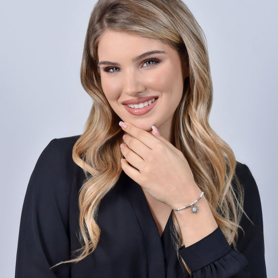 BRACCIALE DONNA IN ACCIAIO CON PERLE SINTETICHE E SOLE