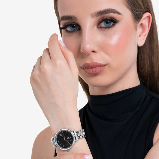 DAMENUHR AUS KRISTALLSTAHL MIT SCHWARZER LÜNETTE UND ZIFFERBLATT