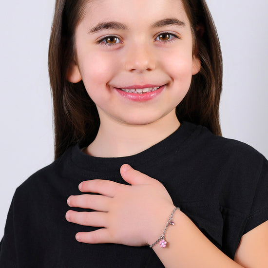 BRACCIALE BAMBINA IN ACCIAIO CON FIORE CON SMALTO ROSA E BIANCO E CRISTALLO